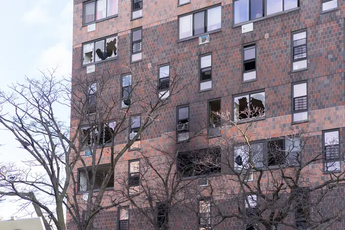 A photo of the exterior of the Bronx building where a fire broke out Sunday